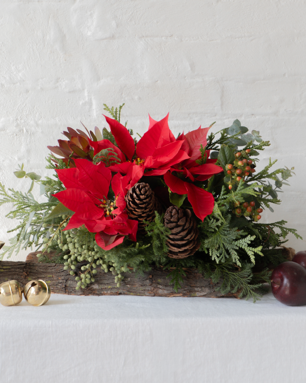 María, centro de mesa navideño montado en tronco