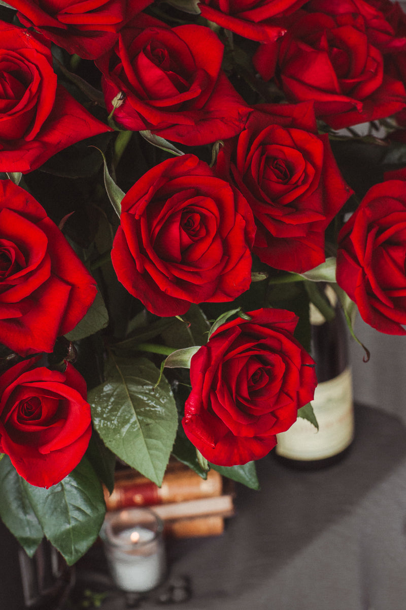 Constanza, 100 rosas rojas de en arreglo floral